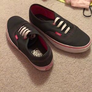 Dark gray vans with pink trim
